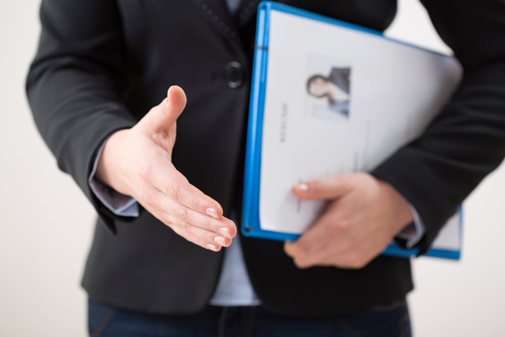 Horizontal view of woman with her curriculum vitae